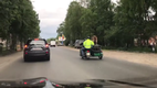 Bear Rides Motorcycle and Waves to People